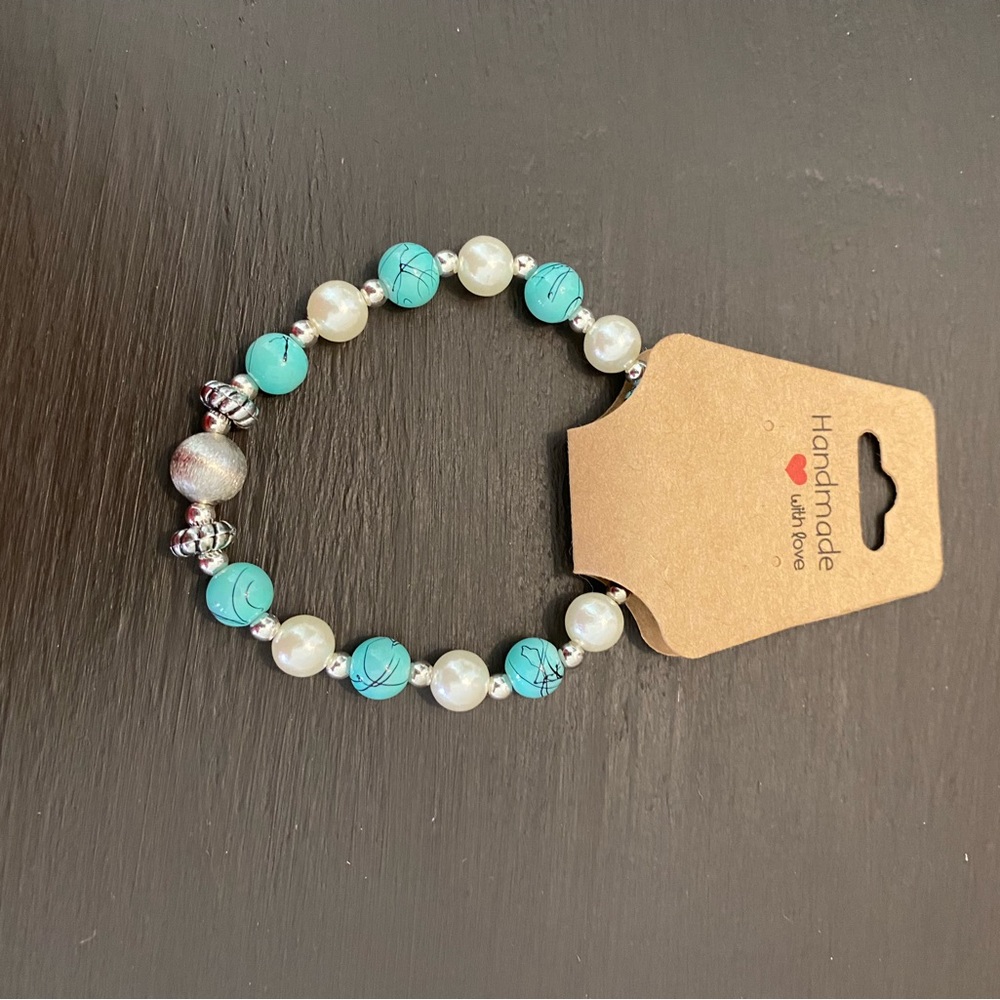 Brand new, never worn, turquoise with silver and faux pearls stretch bracelet